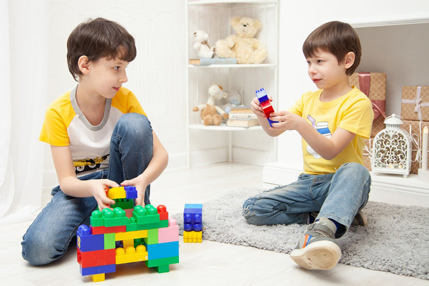 two toys are playing  block toys
