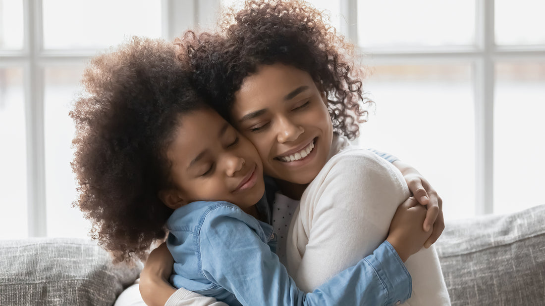 A mother hugs her child