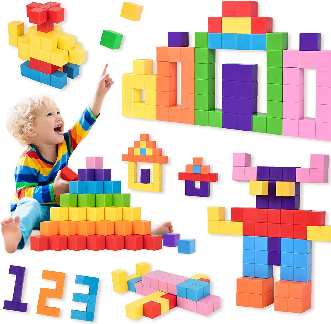 A child is playing with Cossy magnetic cube blocks set